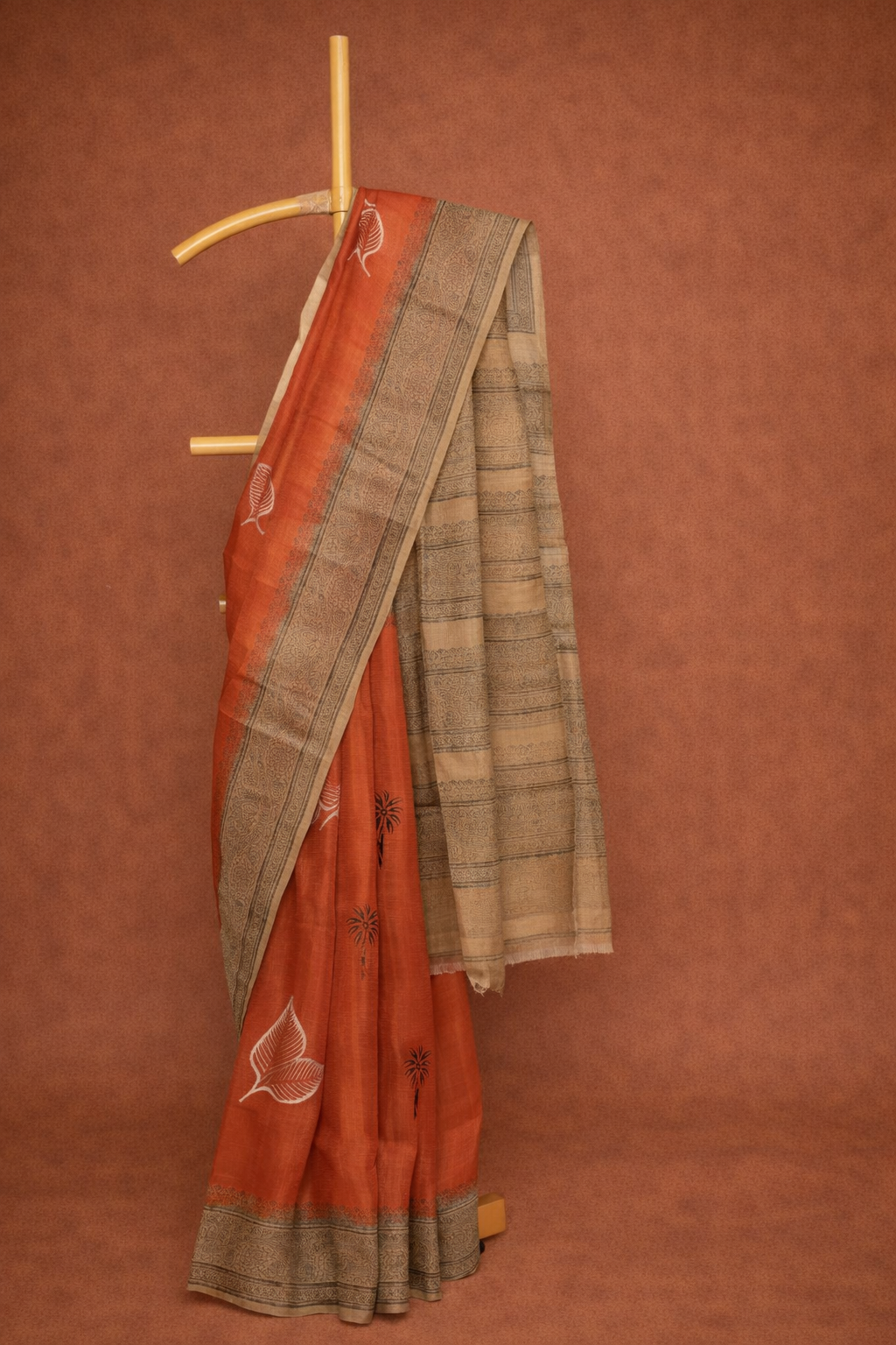 Rust Orange colored dupion silk saree with Traditional Motifs