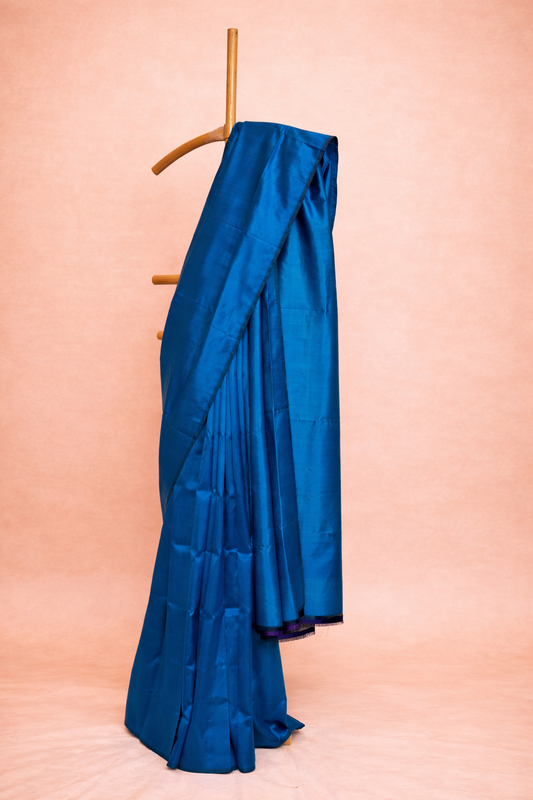 Deep teal blue single colored pure silk saree with cool undertones