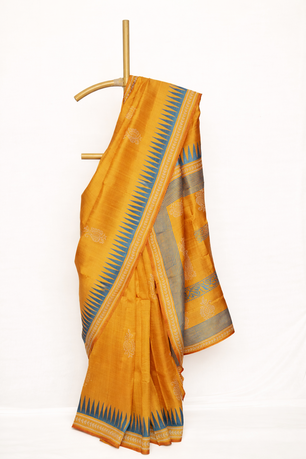 Mustard Yellow colored dupion silk saree with Blue Accents