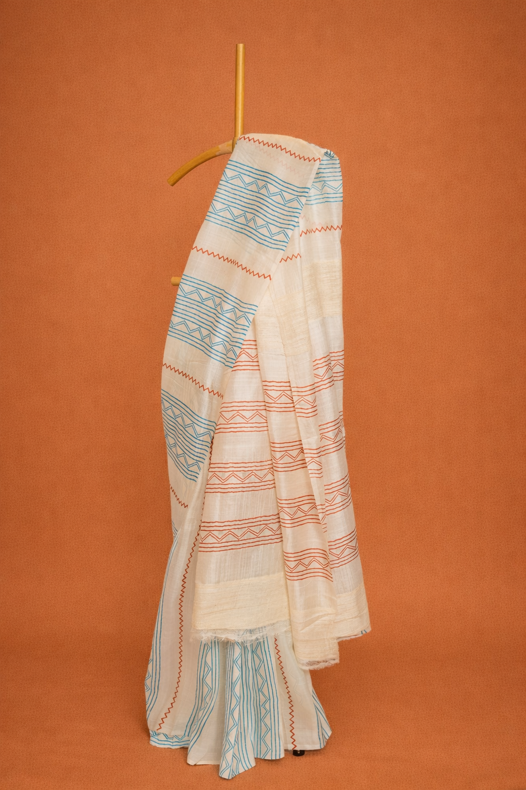 Ivory garad saree with blue & rust geometric stripes