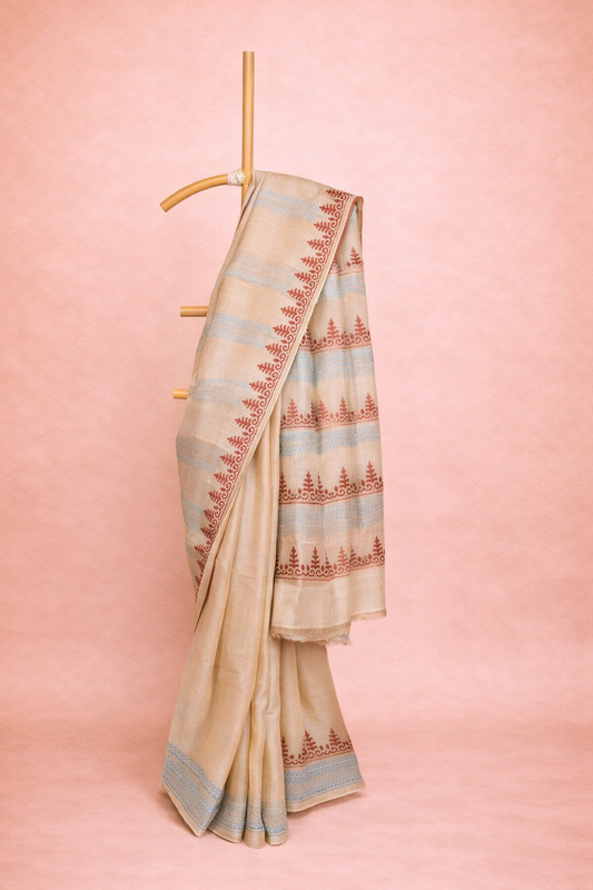 Beige colored block printed hand spun tussar saree with rust red Border