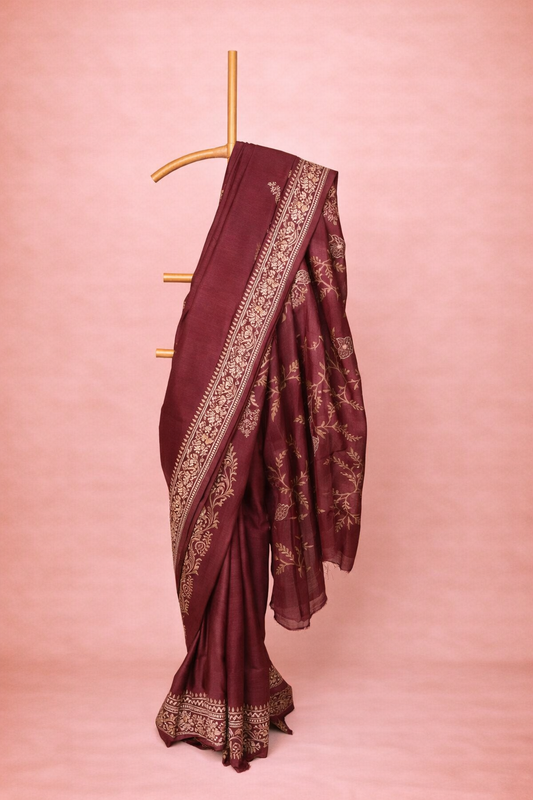Deep maroon colored block printed hand spun tussar saree with antique gold design