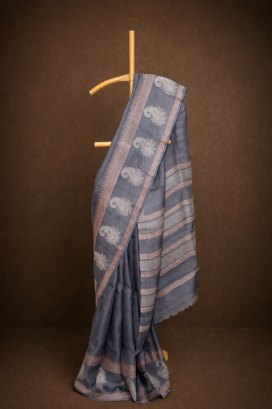 Classic grey colored hand block printed pure tussar silk saree