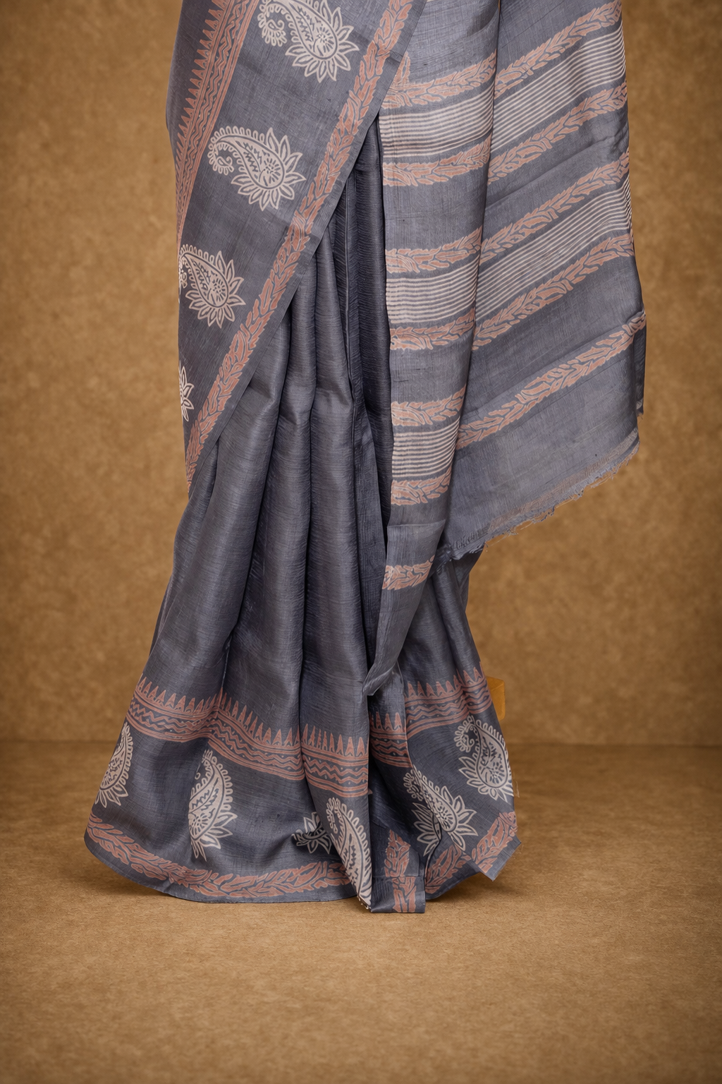 Classic grey colored hand block printed pure tussar silk saree